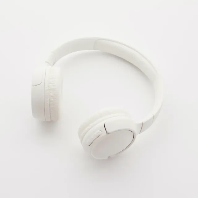 White over-ear headphones on a plain white background