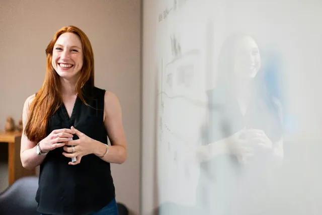 Senior adviser discussing a strategy at a whiteboard