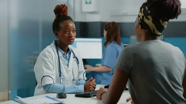 Doctor listening attentively to a patient during a private consultation